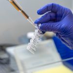 Scientist,Pipetting,Sample,Into,Vial,For,Dna,Testing.,Scientist,Loads